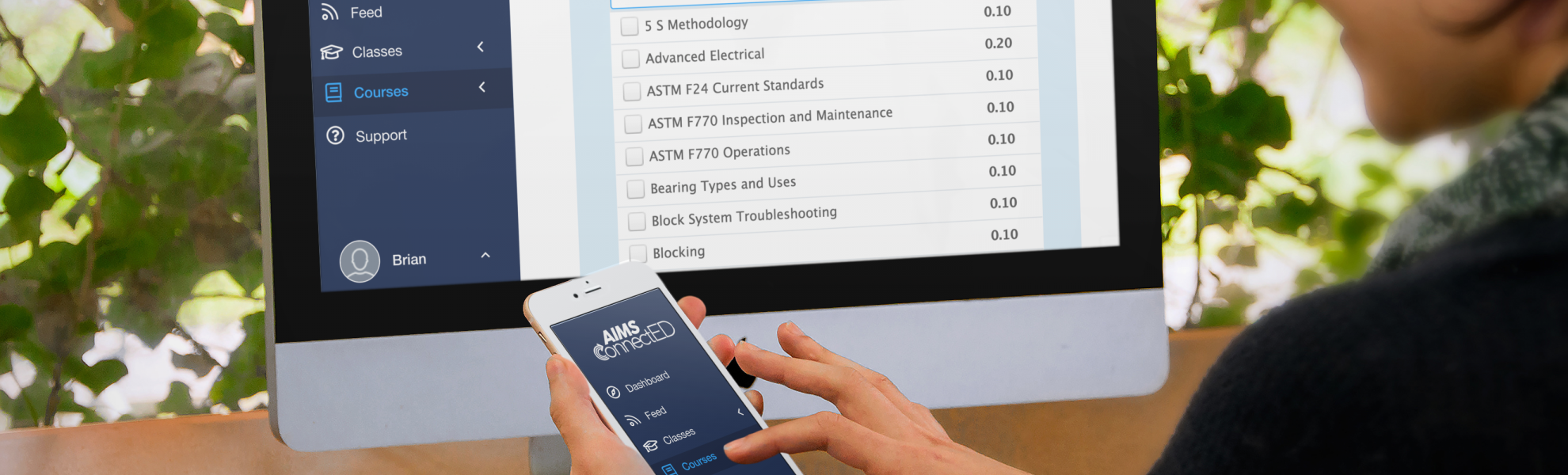Girl using AIMS connected on iPhone and computer